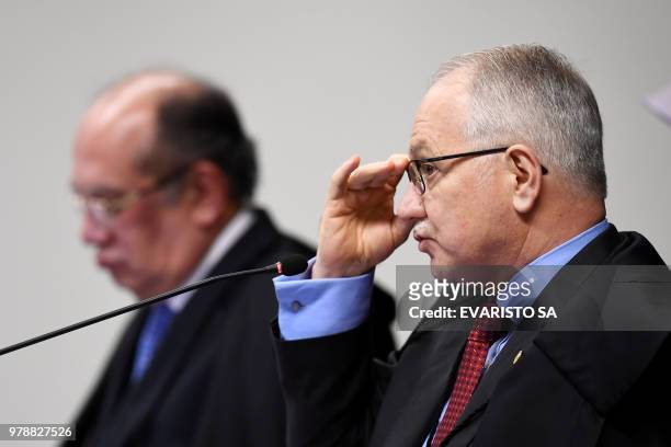 Brazil's Supreme Court judges Edson Fachin and Gilmar Mendes attend the trial of senator and Workers' Party president Gleisi Hoffmann for corruption...