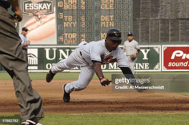 Baltimore Orioles third baseman Melvin Mora dives into third base against the Chicago White Sox July 29, 2006 in Baltimore. The Sox grabbed an early...