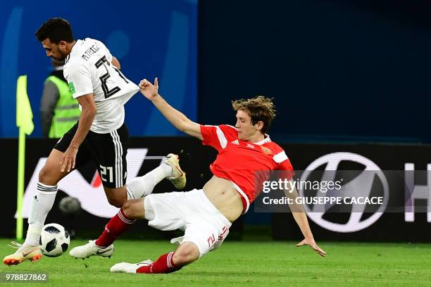 Russia's defender Mario Fernandes fights for the ball with Egypt's forward Mahmoud 'Trezeguet' Hassan during the Russia 2018 World Cup Group A...