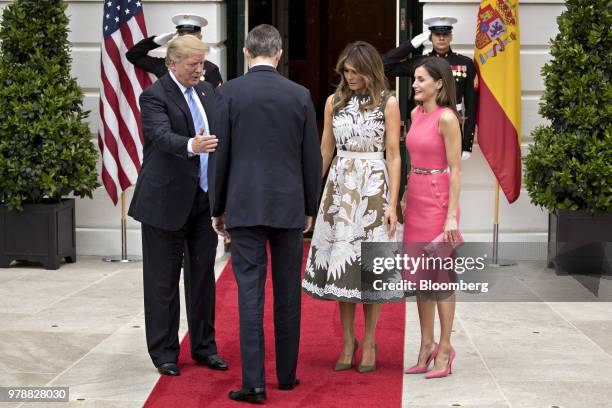 President Donald Trump, left, arranges Felipe VI, Spain's king, center, and Queen Letizia, right, for a photograph with First Lady Melania Trump at...