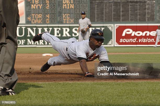 Baltimore Orioles third baseman Melvin Mora dives into third base against the Chicago White Sox July 29, 2006 in Baltimore. The Sox grabbed an early...