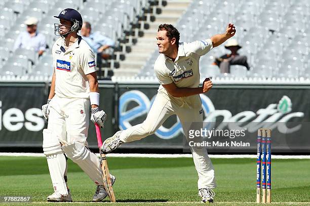 Chris Simpson of the Bulls bowls during day four of the Sheffield Shield Final between the Victorian Bushrangers and the Queensland Bulls at the...