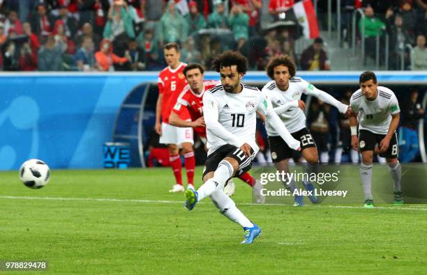Mohamed Salah of Egypt scores his team's first goal from the penalty spot during the 2018 FIFA World Cup Russia group A match between Russia and...