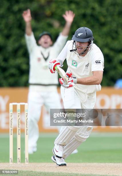Daniel Vettori captain of New Zealand bats as Australia appeals during day two of the First Test match between New Zealand and Australia at Westpac...