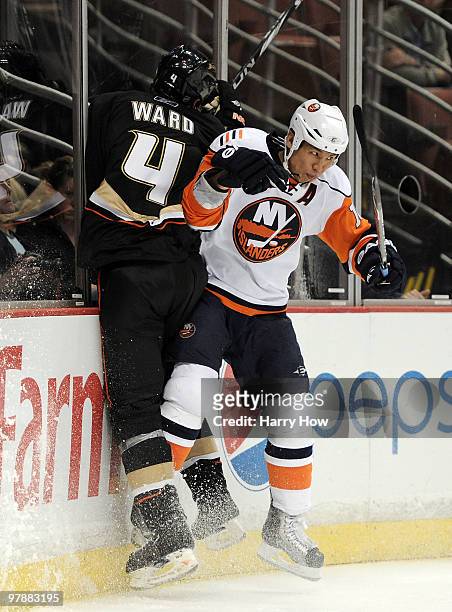 Richard Park of the New York Islanders hits Aaron Ward of the Anaheim Ducks during the second period at the Honda Center on March 19, 2010 in...
