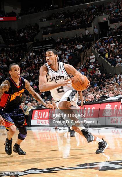 Garrett Temple of the San Antonio Spurs drives against Monta Ellis of the Golden State Warriors on March 19, 2010 at the AT&T Center in San Antonio,...