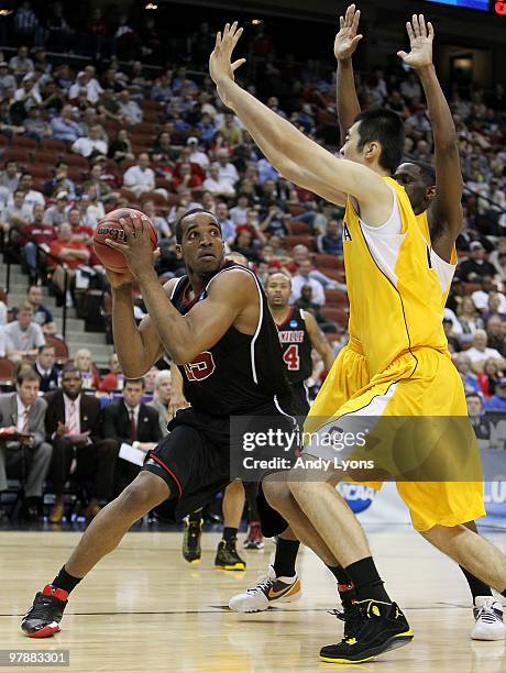 Samardo Samuels of the Louisville Cardinals looks to shoot over Max Zhang of the California Golden Bears during the first round of the 2010 NCAA...
