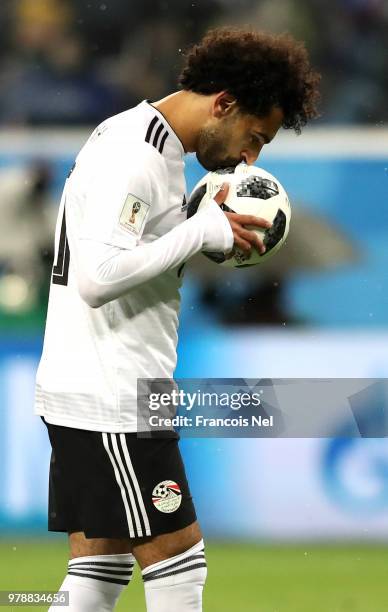 Mohamed Salah of Egypt kisses the ball before scoring from the penalty spot during the 2018 FIFA World Cup Russia group A match between Russia and...