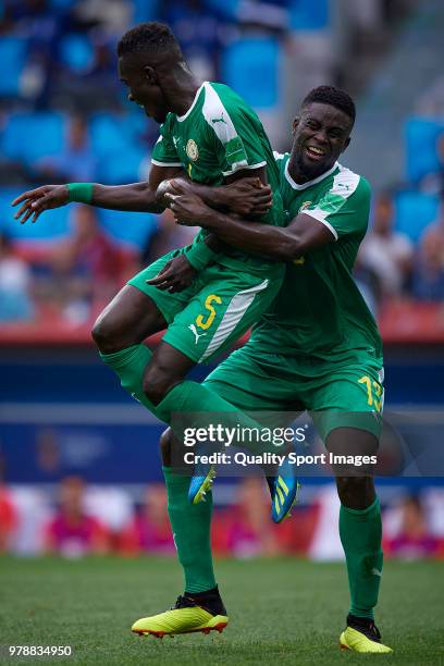 Idrissa Gana Gueye of Senegal celebrates with Alfred Ndiaye of Senegal after scoring his team first goal during the 2018 FIFA World Cup Russia group...