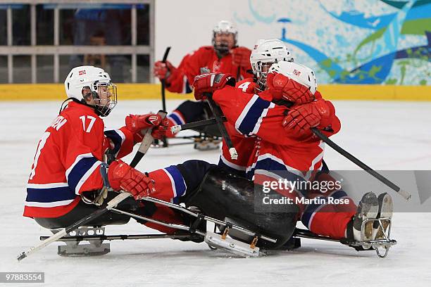 Eskil Hagen of Norway celebrates scoring the game-winning goal with teammates Tommy Rovelstad and Loyd Remi Johansen defeating Canada 2-1 during the...