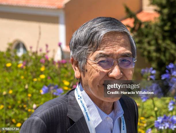 Haruhiko Kuroda, Governor of Bank of Japan, smiles while leaving at the end of the first discussion session of the ECB Forum on Central Banking, on...