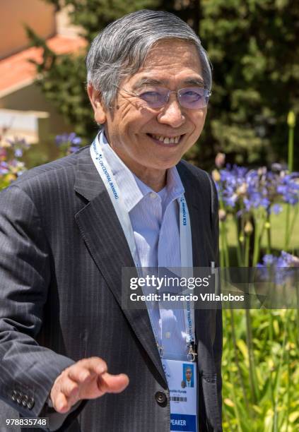 Haruhiko Kuroda, Governor of Bank of Japan, smiles and waves while leaving at the end of the first discussion session of the ECB Forum on Central...