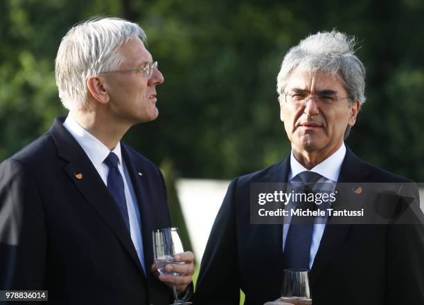 Christoph Franz, Chairman-Supervisory Board at Roche Holding AG and Joe Kaeser, CEO of Siemens AG, arrive at the Schloss Meseberg governmental palace...