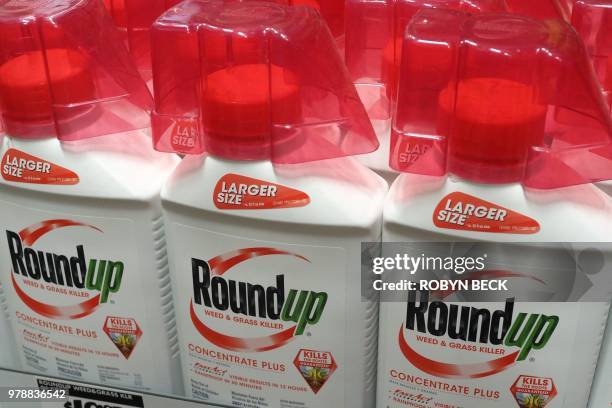 Bottles of Monsanto's Roundup are seen for sale June 19, 2018 at a retail store in Glendale, California. A former groundskeeper who contracted...