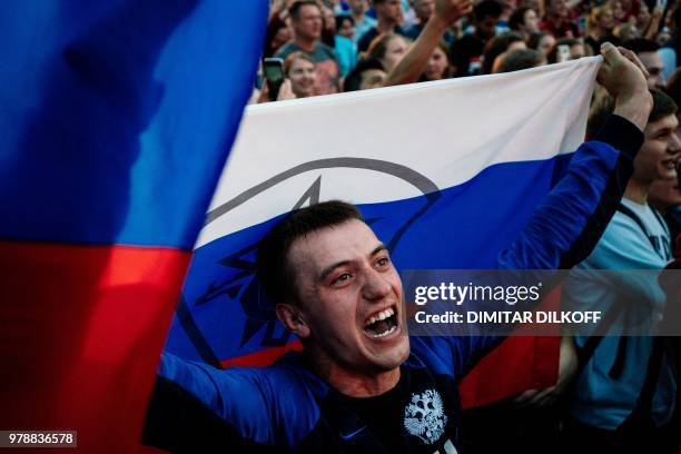 Russian fans watch their team during the Russia 2018 World Cup Group A football match between Russia and Egypt, at the Fan Zone in Nizhny Novgorod on...