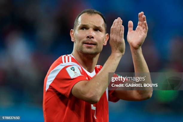 Russia's defender Sergey Ignashevich celebrates after the final whistle of the Russia 2018 World Cup Group A football match between Russia and Egypt...
