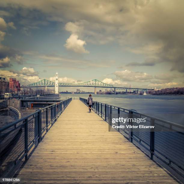 boardwalk to clock tower (montreal) - clock tower beach canada stock pictures, royalty-free photos & images