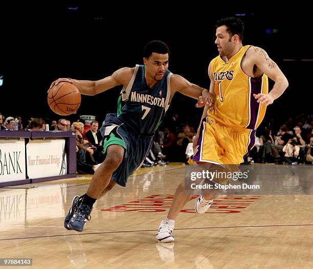 Ramon Sessions of the Minnesota Timberwolves drives around Jordan Farmar of the Los Angeles Lakers on March 19, 2010 at Staples Center in Los...