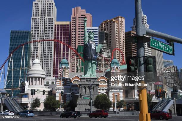 New York-New York Hotel & Casino's half-size replica of Lady Liberty wears a Las Vegas Aces jersey to celebrate the WNBA team's inaugural season on...
