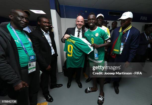 President Gianni Infantino poses with Mame Diouf of Senegal following the 2018 FIFA World Cup Russia group H match between Poland and Senegal at...