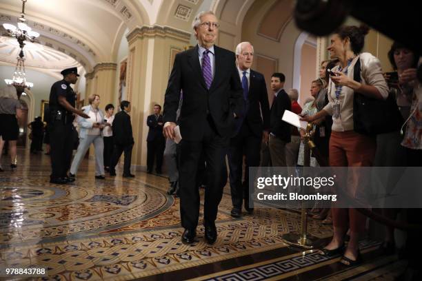 Senate Majority Leader Mitch McConnell, a Republican from Kentucky, center, arrives for a news conference following a Senate weekly luncheon meeting...