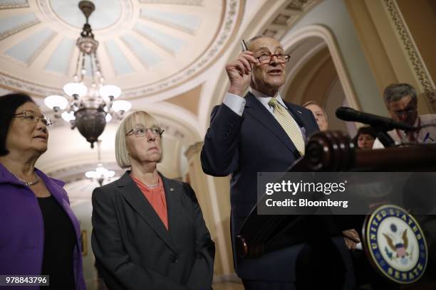 Senate Minority Leader Chuck Schumer a Democrat from New York, right, speaks during a news conference following a Senate weekly luncheon meeting at...