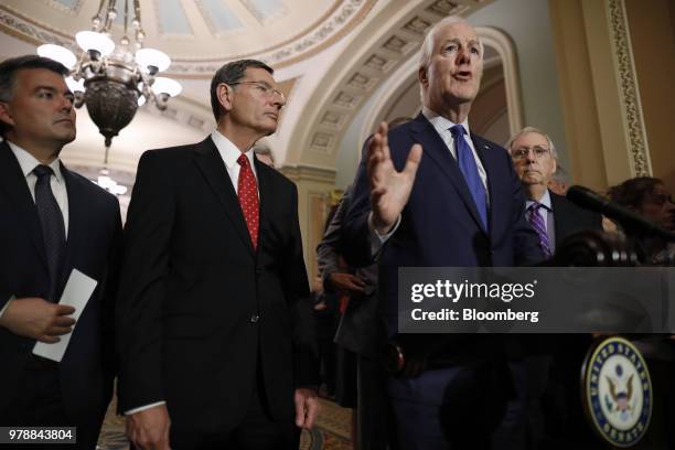 Senate Majority Whip John Cornyn, a Republican from Texas, right, speaks during a news conference ahead of a Senate weekly luncheon meeting at the...