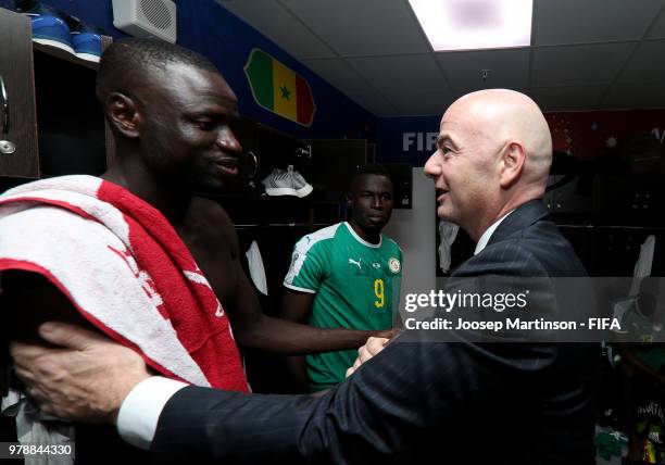 President Gianni Infantino congratulates Cheikhou Kouyate of Senegal following the 2018 FIFA World Cup Russia group H match between Poland and...