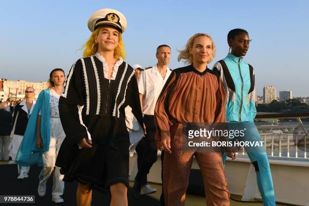 Models present creations for Koche fashion house during "Open My Med" fashion show on June 19, 2018 in Marseille.