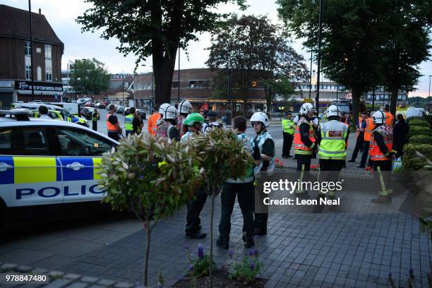 Members of the emergency services work around the entrance to Southgate underground station following reports of an explosion on June 19, 2018 in...