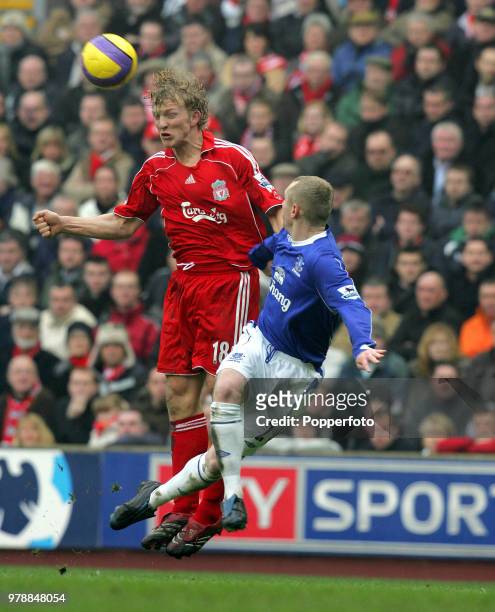 Dirk Kuyt of Liverpool and Tony Hibbert of Everton in action during the Barclays Premiership match between Liverpool and Everton at Anfield in...