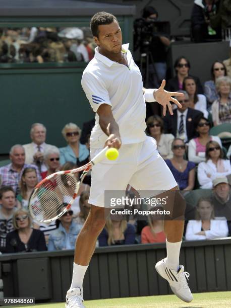 Jo-Wilfried Tsonga of France enroute to losing his Men's Singles semi-final match on Day 11 of the Wimbledon Lawn Tennis Championships at the All...