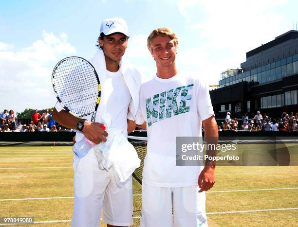 Defeated boys' singles finalist Liam Broady of Great Britain is invited by Rafael Nadal of Spain to be his warm-up partner in a final practice...