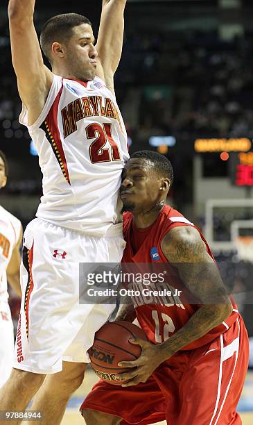 Aubrey Coleman of the Houston Cougars runs up against Greivis Vasquez of the Maryland Terrapins during the first round of the 2010 NCAA men's...