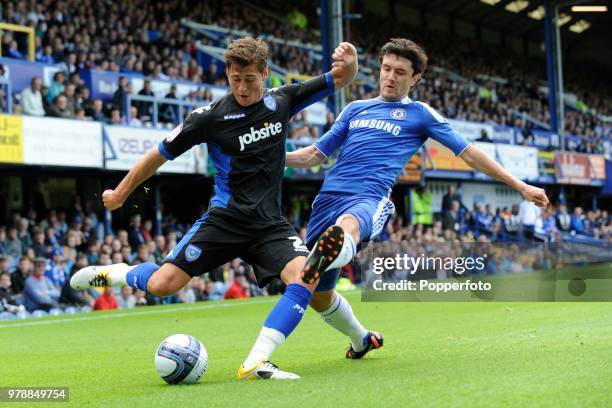 Yury Zhirkov of Chelsea and Joel Ward of Portsmouth in action during a pre-season friendly match between Portsmouth and Chelsea at Fratton Park in...