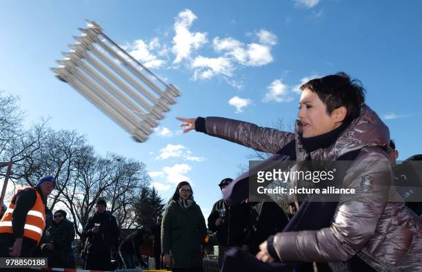 Part of a heater is flung through the air in an oil radiator thowing competition in Gueldengossa, Germany, 24 February 2018. The competition is part...