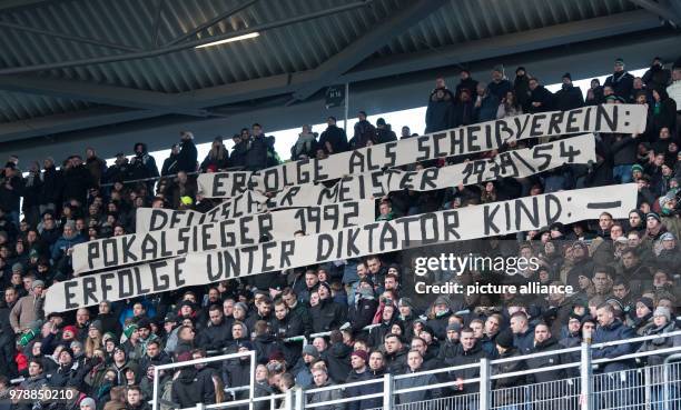 February 2018, Germany, Hanover: German Bundesliga match between Hanover 96 and Borussia Moenchengladbach at the HDI Arena. Banners held up by...
