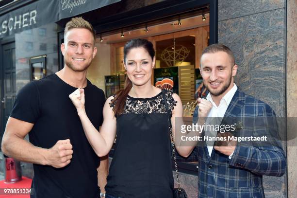 Sebastian Preuss, Marie Lang and Dardan Morina attend the launch event for watchmaking company NOMOS Glashuette at Juweler Hilscher on June 19, 2018...