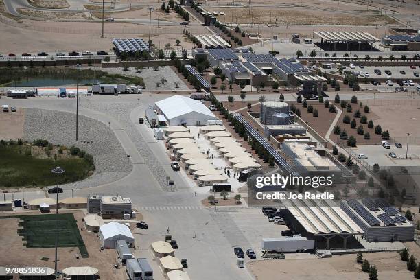 Children and workers are seen at a tent encampment recently built near the Tornillo Port of Entry on June 19, 2018 in Tornillo, Texas. The Trump...