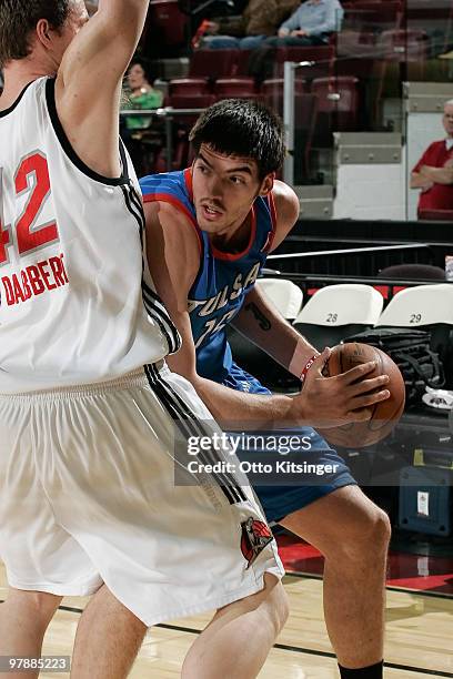 Byron Mullens of the Tulsa 66ers looks to pass around Joe Dabbert of the Idaho Stampede at Qwest Arena on March 19, 2010 in Boise, Idaho. NOTE TO...