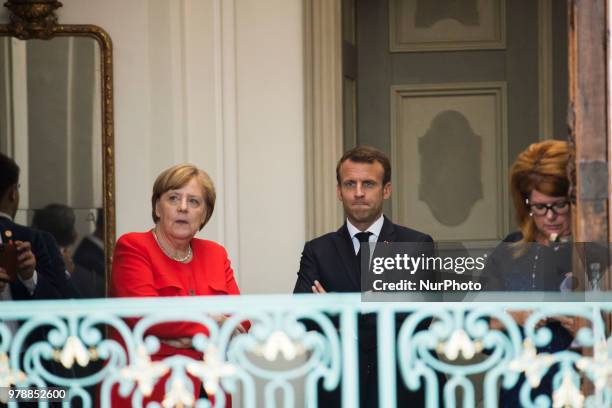 German Chancellor Angela Merkel and French President Emmanuel Macron await for the arrival of President of the EU Commission Jean-Claude Juncker...