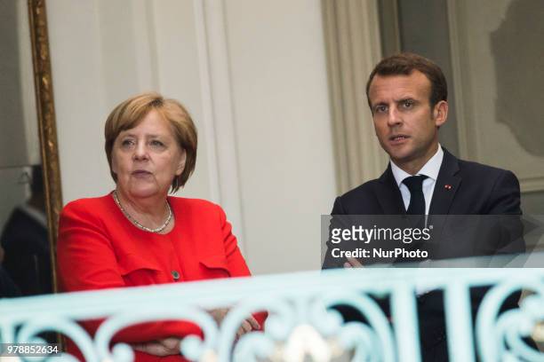 German Chancellor Angela Merkel and French President Emmanuel Macron await for the arrival of President of the EU Commission Jean-Claude Juncker...