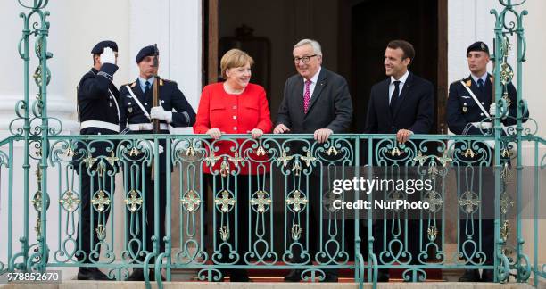 German Chancellor Angela Merkel , French President Emmanuel Macron and President of the EU Commission Jean-Claude Juncker pose for a picture before a...