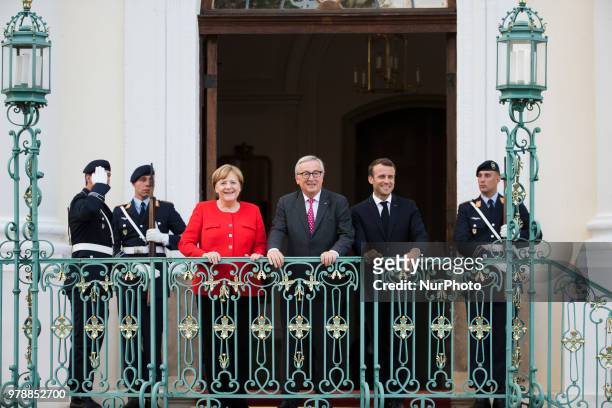 German Chancellor Angela Merkel , French President Emmanuel Macron and President of the EU Commission Jean-Claude Juncker pose for a picture before a...