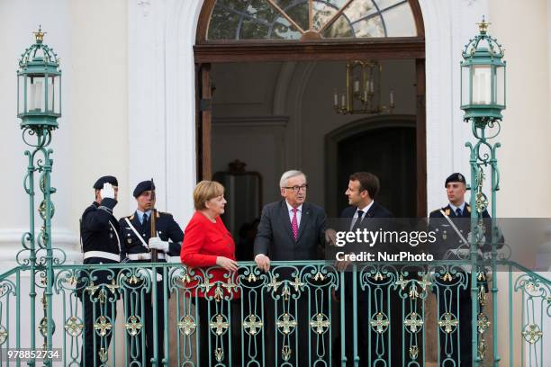 German Chancellor Angela Merkel , French President Emmanuel Macron and President of the EU Commission Jean-Claude Juncker pose for a picture before a...