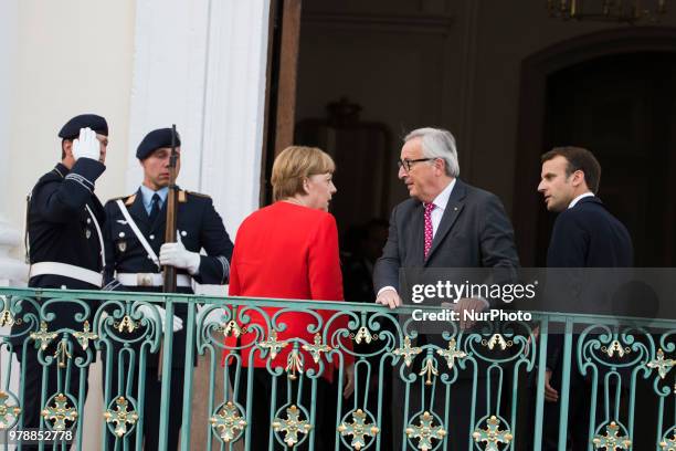 German Chancellor Angela Merkel , French President Emmanuel Macron and President of the EU Commission Jean-Claude Juncker pose for a picture before a...