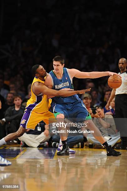 Darko Milicic of the Minnesota Timberwolves posts up against DJ Mbenga of the Los Angeles Lakers at Staples Center on March 19, 2010 in Los Angeles,...