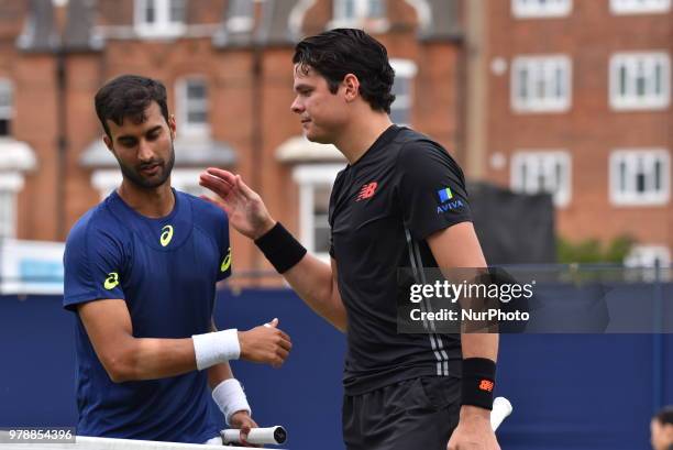 Milos Raonic of Canada wins against Yuki Bhambri in the first singles match on day two of Fever Tree Championships at Queen's Club, London on June...