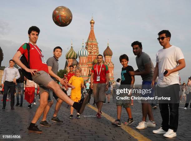 Socceroos fan Max Sampson, aged 10, from Adelaide plays football in Red Square with Moroccan fans during The World Cup Tournament on June 19, 2018 in...