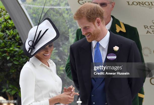 Prince Harry, Duke of Sussex and Meghan, Duchess of Sussex, making her Royal Ascot debut, attend the first day of Royal Ascot on June 19, 2018 in...